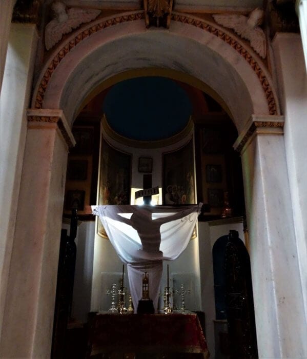 Shadow of Jesus on a cross in a church. Syros, Greece