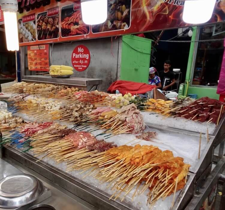 Food stall-food on sticks. Starting a new life abroad