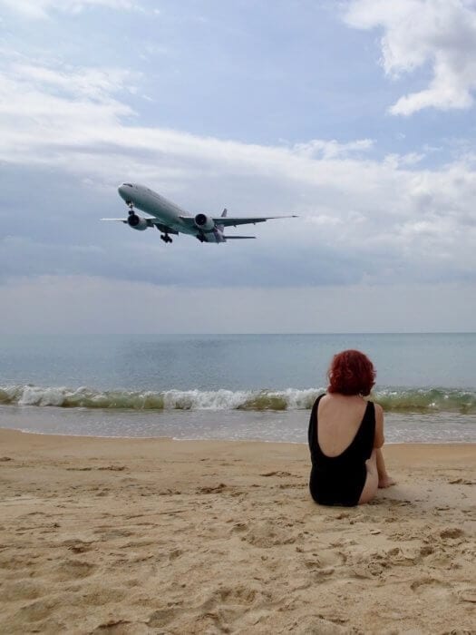 Plane landing overhead while I sitting on beach-unusual things to do in Phuket