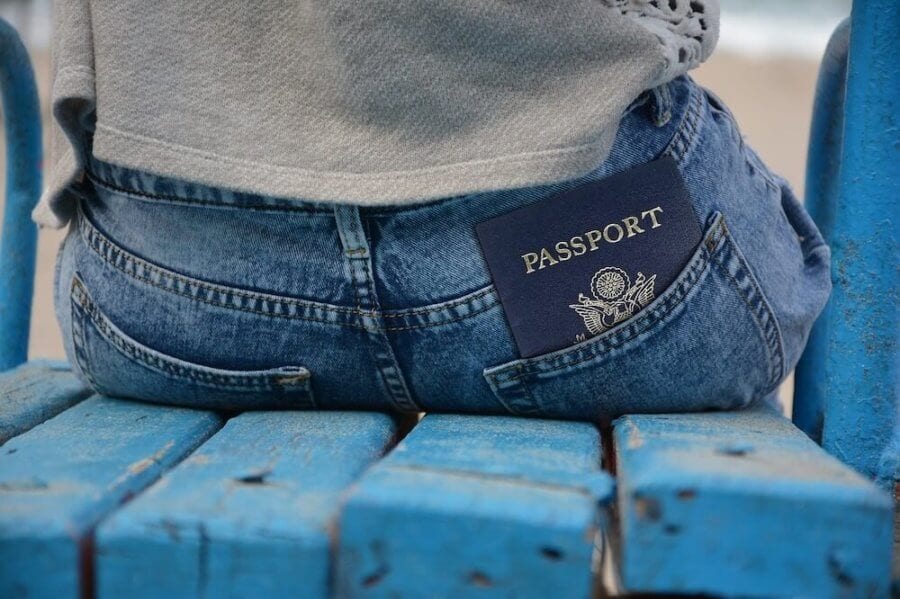 passport in the back pocket of jeans