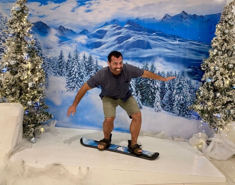 Mark snowboarding in fake scenery