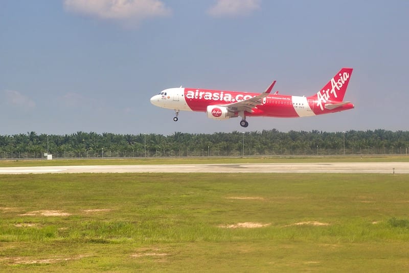 red Air Asia plane landing- dos and don't in Malaysia