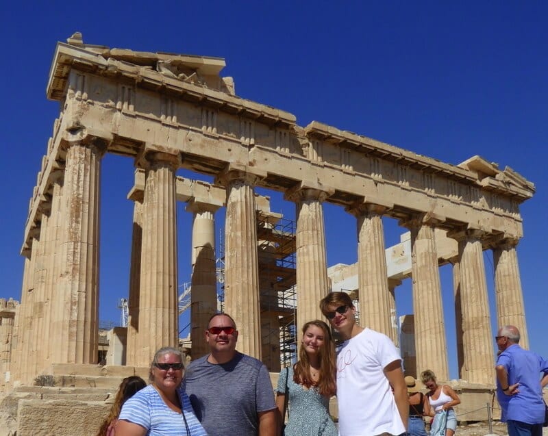 family in Greece in front of ruins: multicultural kids