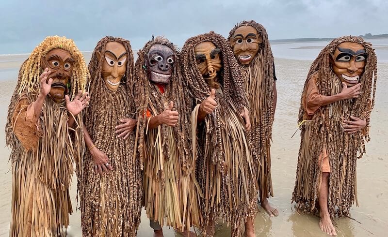 Mah Meri men on the beach in wooden masks. One of the best festivals of malaysia