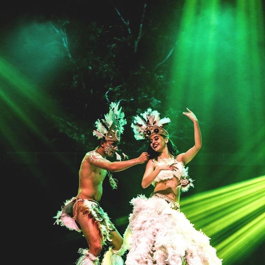 Tribal couple dancing. Rainforest Music Festival