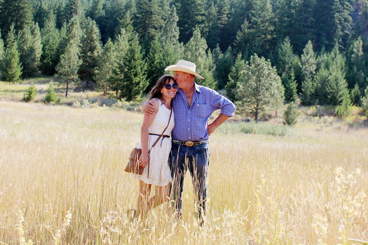 Cute cowboy couple in a field