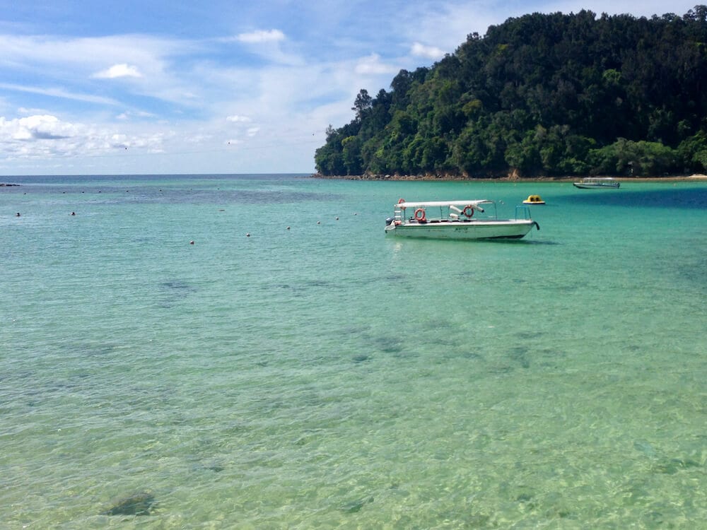 clear water with boat Gaya Island Kota Kinabalu Itinerary