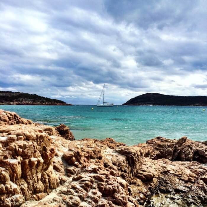 Corsica, France. Sailboat on turquoise water