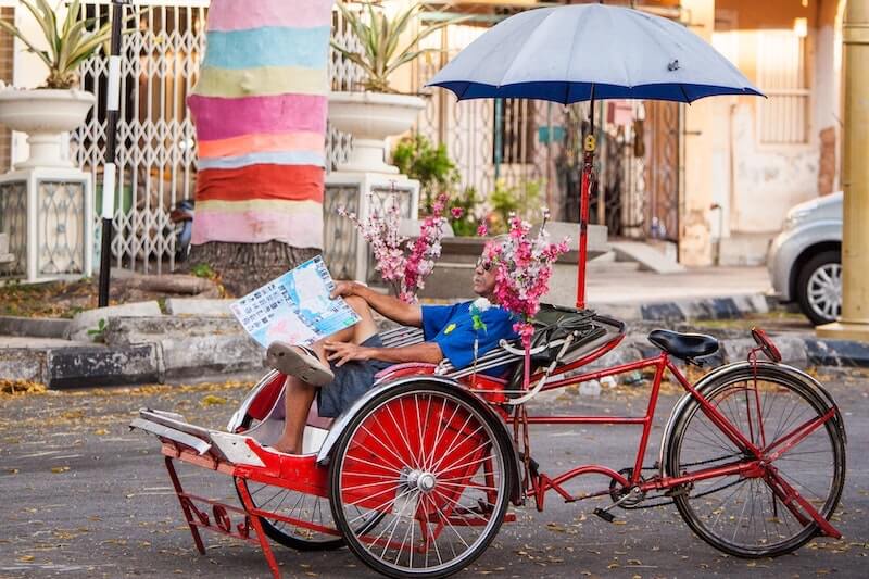 trishaw driver taking a rest