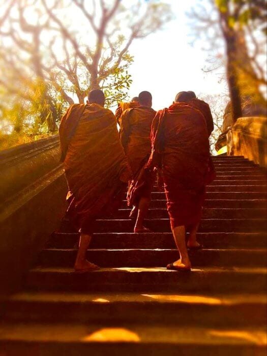 Daily scenes of monks walking up the stairs for an Expat in Chiang Mai