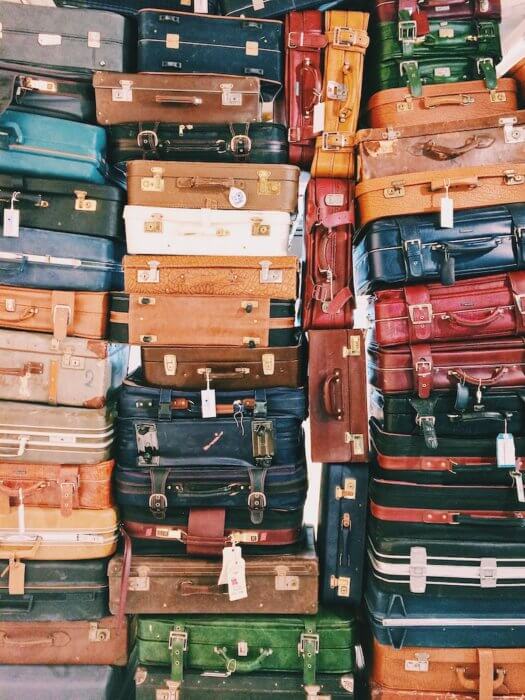 stack of suitcases moving to Malaysia