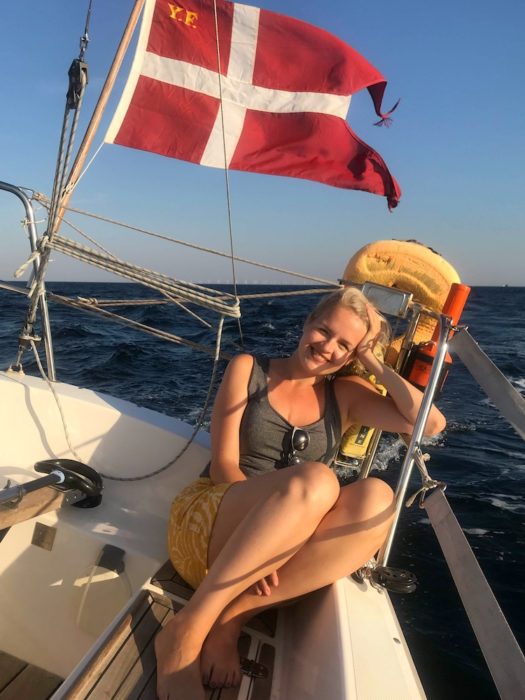 blonde girl on a boat in the sun