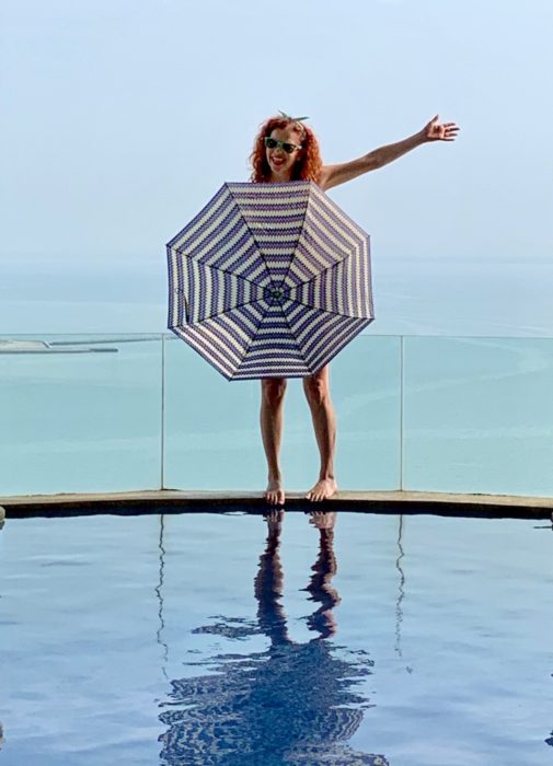 me with umbrella on edge of pool: improve quality of life