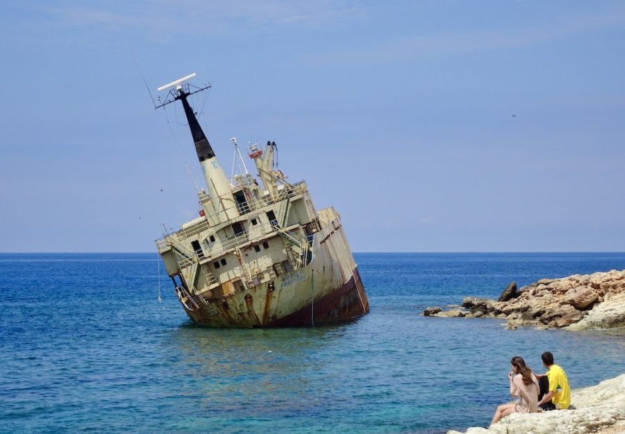 couple looking at a shipwreck