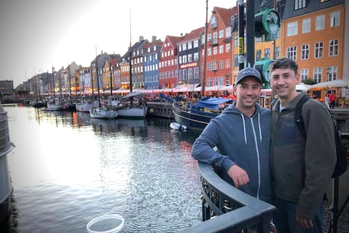 two guys standing near river in Copenhagen