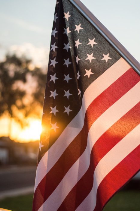 American flag with sunset