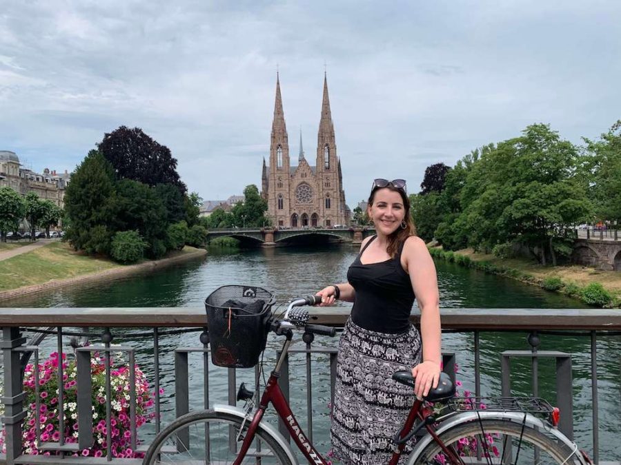 Carlie living in Strasbourg, France with a bike by the river