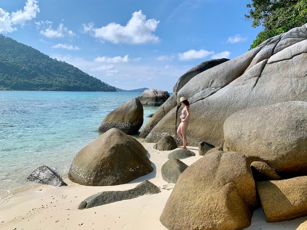 me in the boulders on beach, short getaway in malaysia