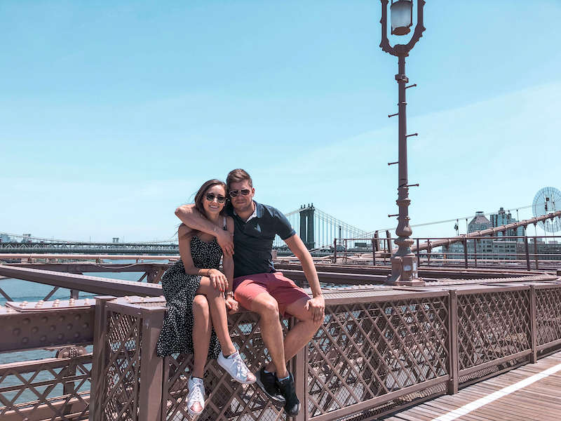 Couple sitting on a bridge: living in Croatia