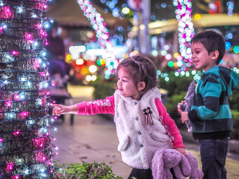 2 kids looking at Christmas lights in Taiwan