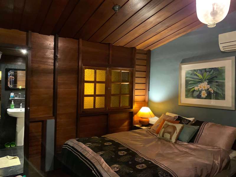 bedroom with wood and blue walls