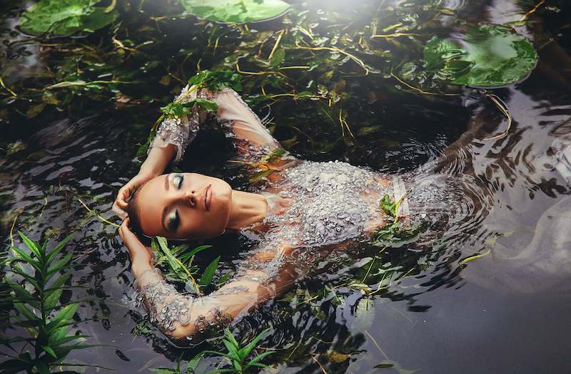 beautiful woman floating in river: Malaysian Legends 