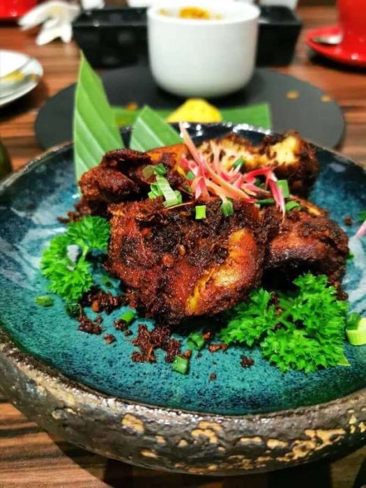 Fried chicken on blue dish