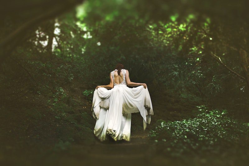 woman in forest white dress