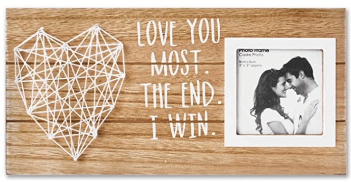 Wooden picture frame with string heart that reads Love you Most. The end. I win.