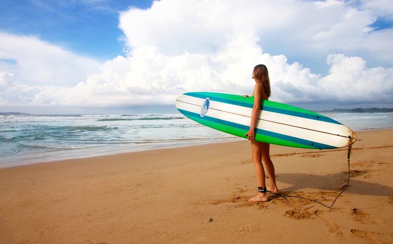 girl holding surf board in Cherating malaysia