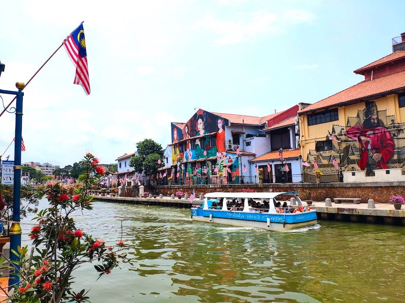 Blue river boat along the Melaka River: what to do in Melaka