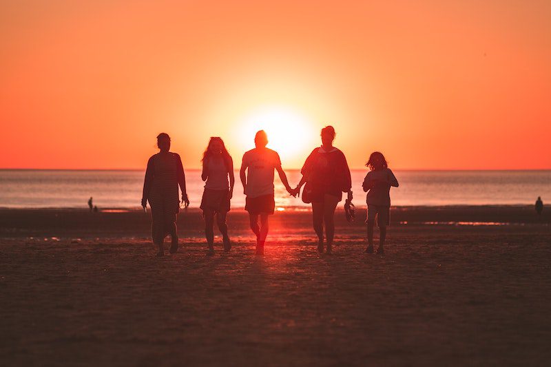 group of friends in sunset