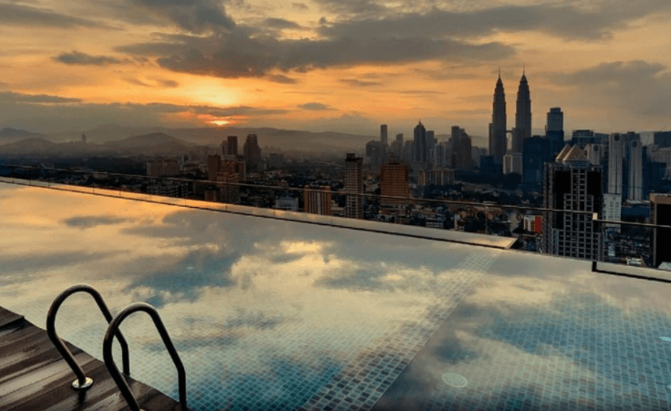 rooftop pool with a view of the petronas towers you can live in KL