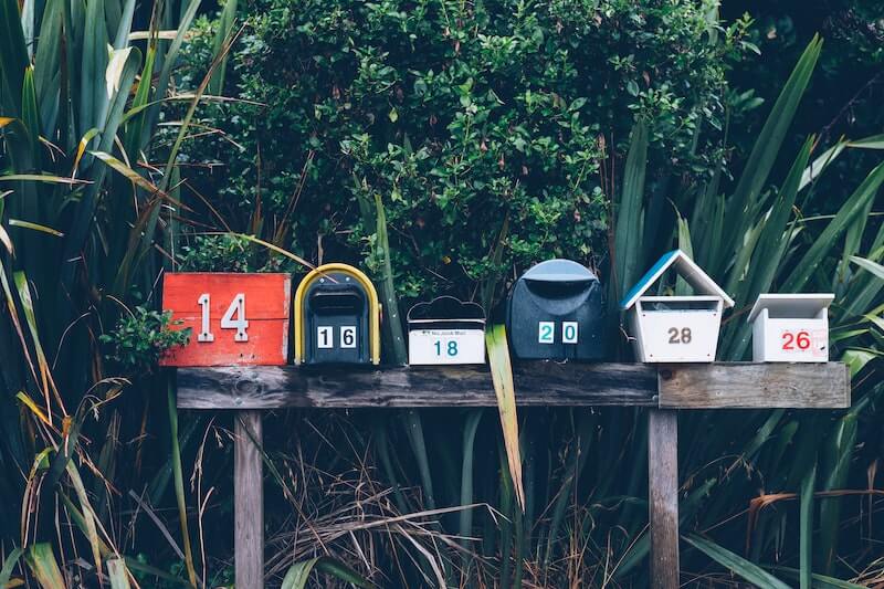 row of mailboxes in the trees
