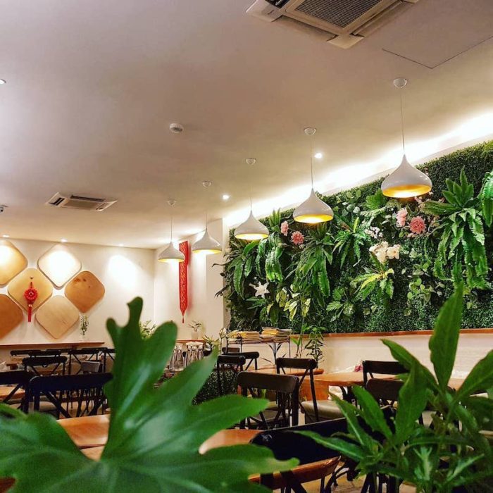 a green living wall in a Penang cafe 