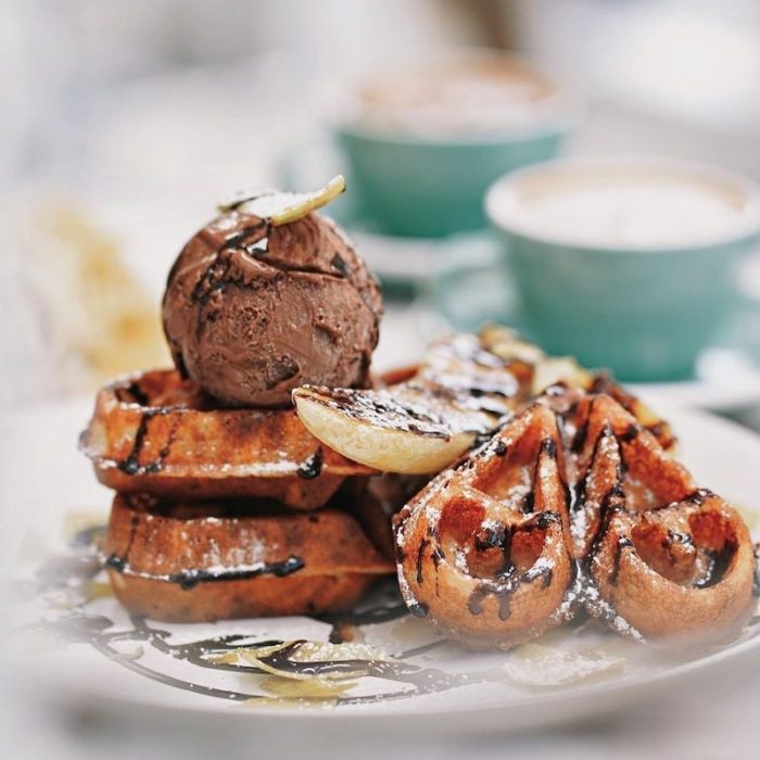 heart shaped waffles with chocolate ice cream and bananas