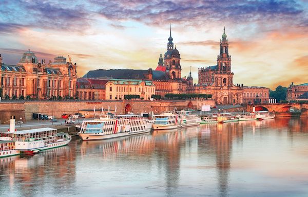 Dresden Germany along the river with boats and old buildings