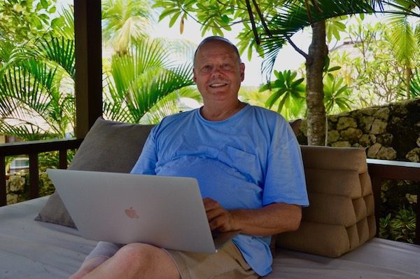 expat in Vietnam working on his laptop