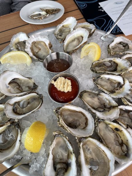 plate of oysters with sauces
