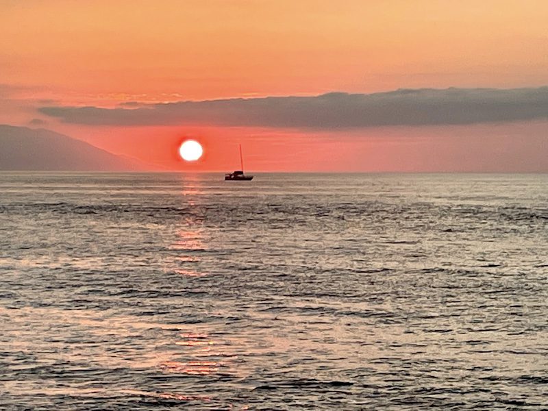orange sunset with sailboat