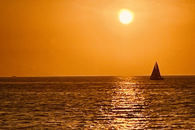 epic orange sunset with sailboat in Puerto Vallarta