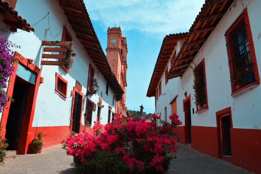 Tapalpa town with red flowers and red and white buildings