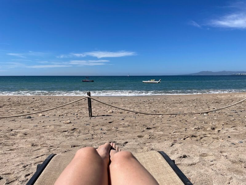 a womans legs on the beach in 5 de diciembre Puerto Vallarta