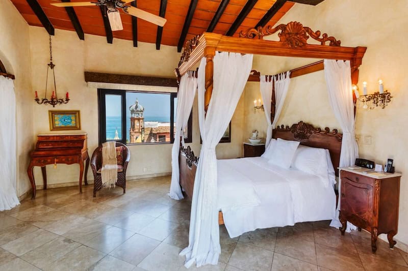 Antique 4-poster bed and furniture at Hacienda San Angel in Puerto Vallarta