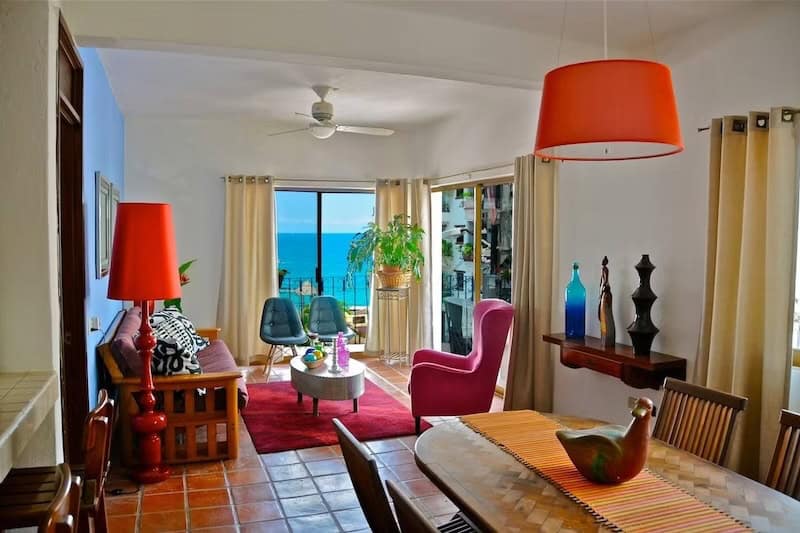 Colorful hotel room with ocean view at Villa Mercedes Petit Hotel in Puerto Vallarta