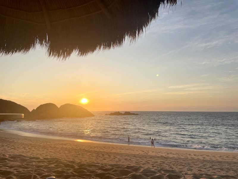 sunset in Mayto Jalisco with a few people on the beach