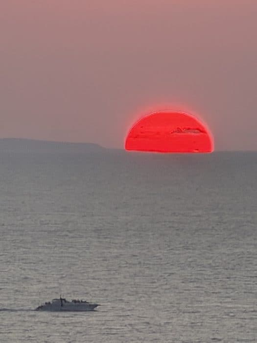 big red sunset after the rains in Puerto Vallarta, Mexico